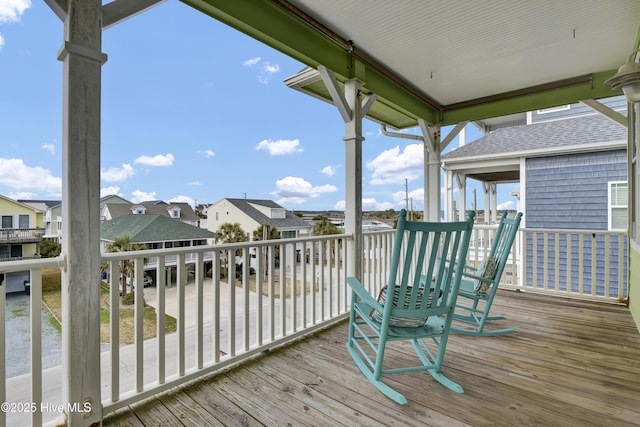 wooden terrace with a residential view