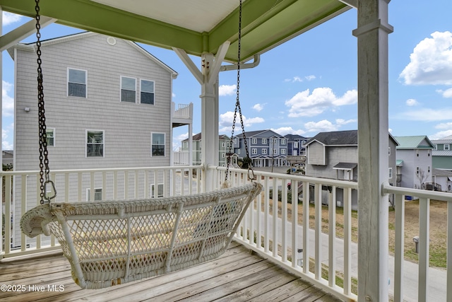 wooden terrace with a residential view