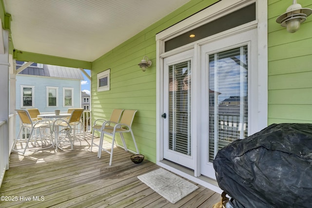 wooden deck with outdoor dining space