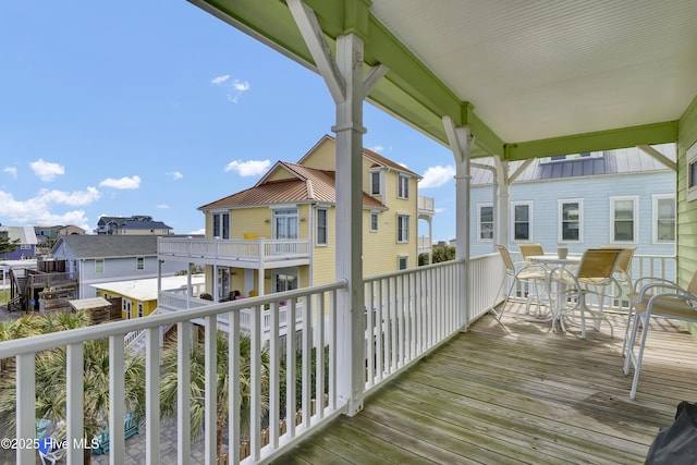 wooden deck featuring a residential view