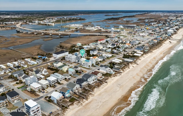 bird's eye view with a beach view and a water view