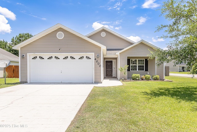 4000 W T Whitehead Dr, Jacksonville, NC 28546 - ranch-style house with concrete driveway and an attached garage