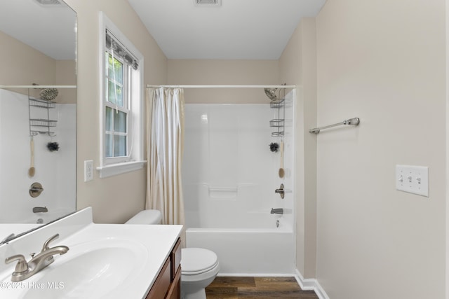 4000 W T Whitehead Dr, Jacksonville, NC 28546 - bathroom featuring wood finished floors, vanity, and shower / tub combo with curtain