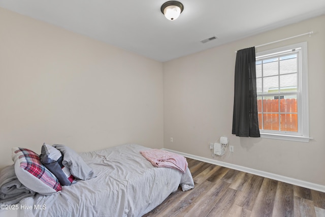4000 W T Whitehead Dr, Jacksonville, NC 28546 - bedroom with wood finished floors and baseboards