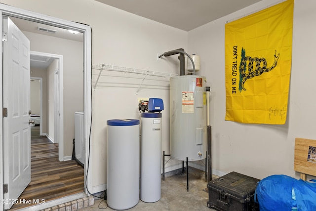 4000 W T Whitehead Dr, Jacksonville, NC 28546 - utility room featuring water heater and washer / dryer