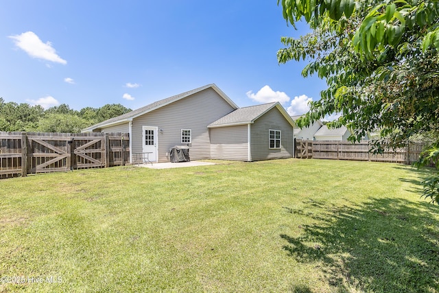 4000 W T Whitehead Dr, Jacksonville, NC 28546 - rear view of property with a fenced backyard and a patio area