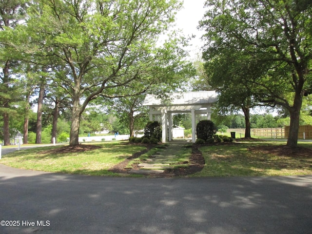 7907 Reunion Rd, Wilmington, NC 28411 - view of front of house featuring fence and a front yard