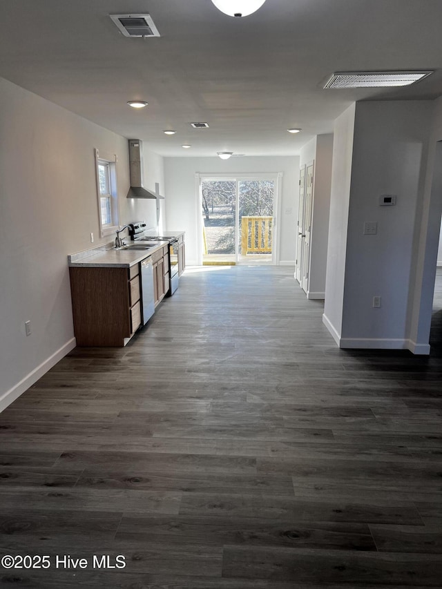 kitchen with white dishwasher, visible vents, wall chimney exhaust hood, plenty of natural light, and dark wood finished floors