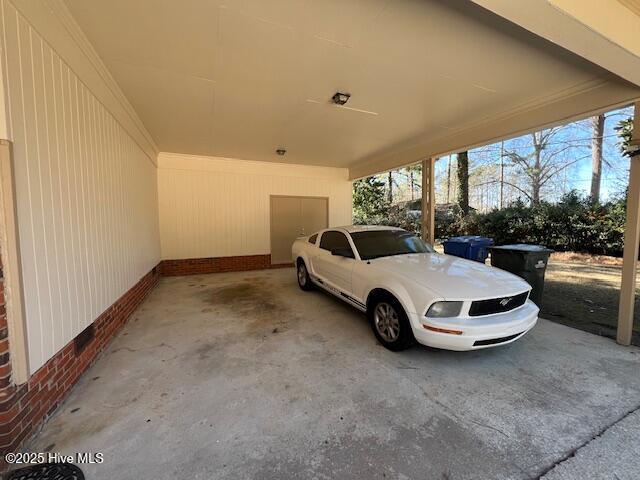 view of parking featuring an attached carport