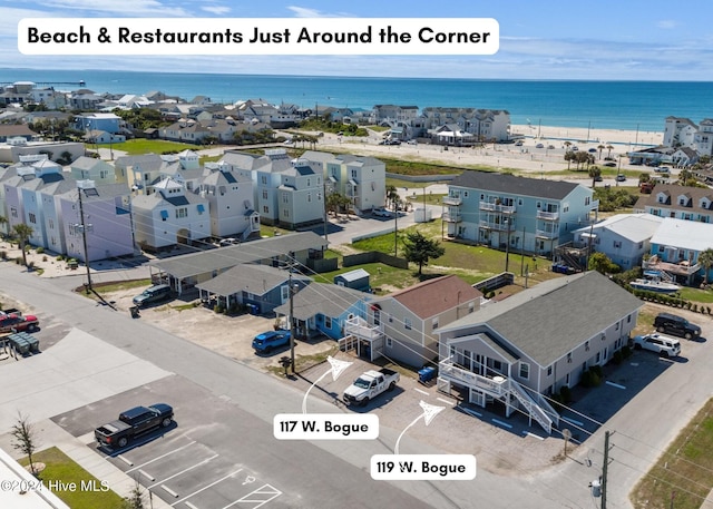 drone / aerial view with a water view and a residential view