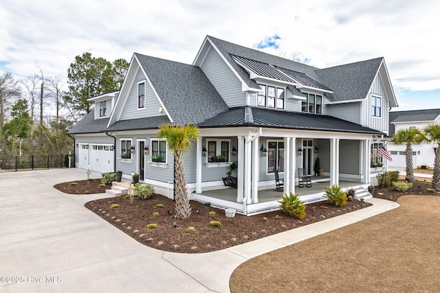 modern farmhouse style home featuring a garage, a standing seam roof, a shingled roof, and a porch