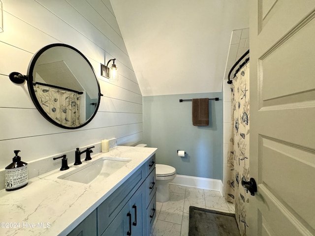 full bathroom featuring toilet, vanity, baseboards, vaulted ceiling, and marble finish floor