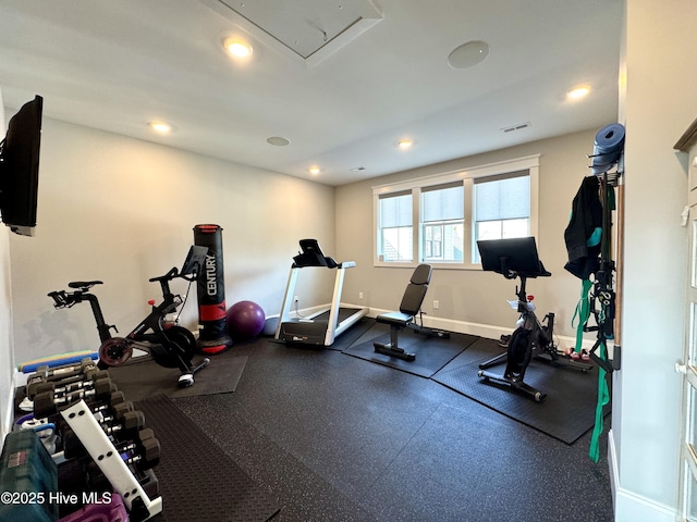 workout area featuring visible vents, baseboards, and recessed lighting