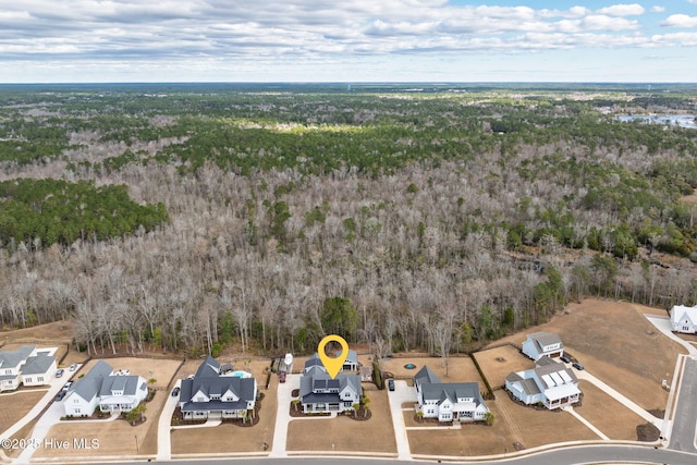 aerial view with a residential view and a wooded view