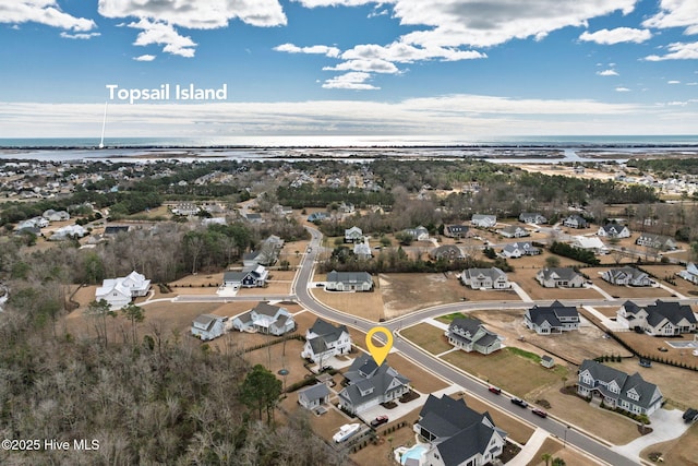 bird's eye view featuring a water view and a residential view