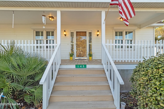 entrance to property with a porch