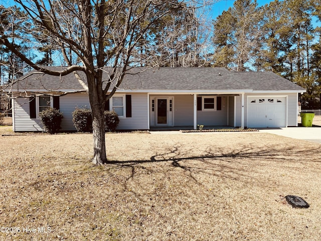 ranch-style house with driveway, roof with shingles, and an attached garage