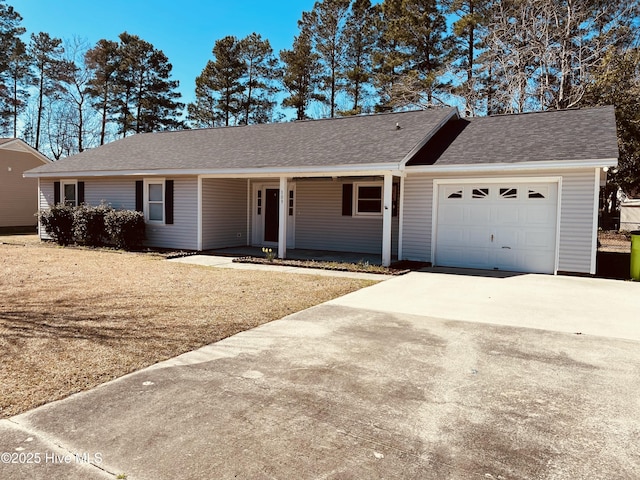 single story home with a garage, concrete driveway, a porch, and roof with shingles