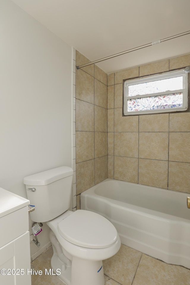 bathroom featuring bathing tub / shower combination, vanity, toilet, and tile patterned floors