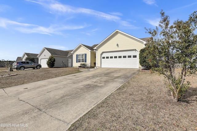 ranch-style home featuring an attached garage and concrete driveway