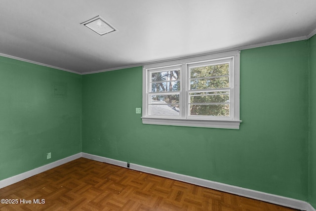 unfurnished room featuring crown molding and baseboards