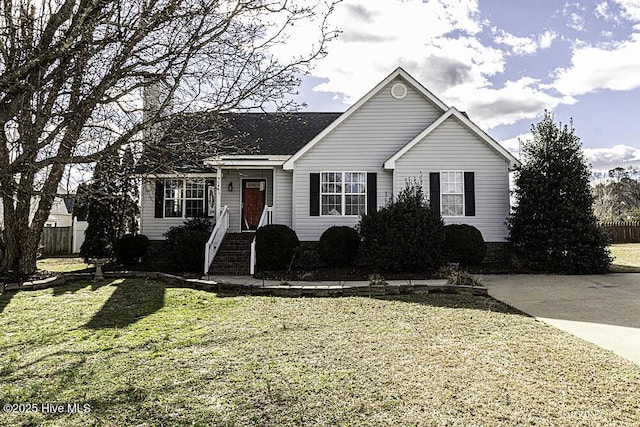 single story home with a front yard and fence