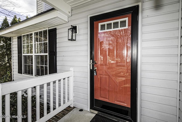 doorway to property featuring a porch