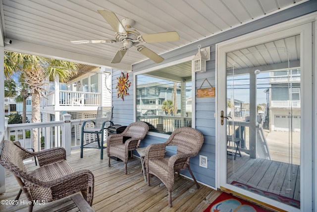 wooden deck with ceiling fan