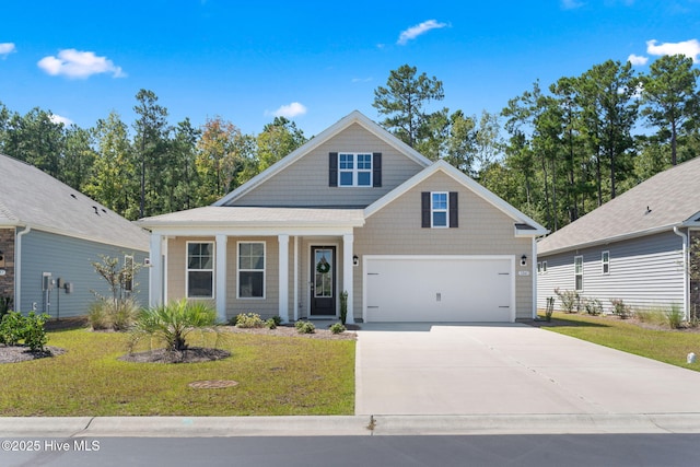 view of front of property with a garage, a front yard, and driveway