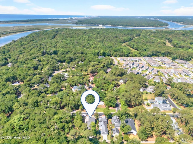 9118 E Lake Rd, Calabash, NC 28467 - aerial view of property and surrounding area with a large body of water, a heavily wooded area, and nearby suburban area