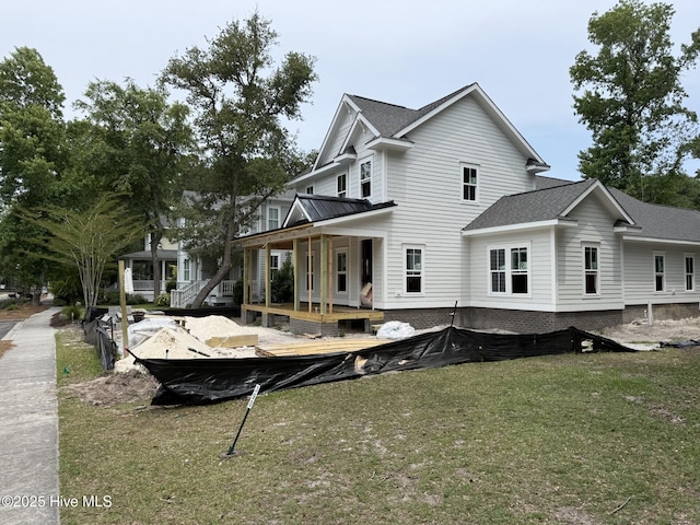 9118 E Lake Rd, Calabash, NC 28467 - back of property featuring a lawn, a porch, and roof with shingles