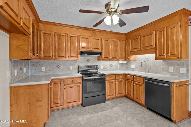 kitchen featuring dishwashing machine, brown cabinets, under cabinet range hood, and electric stove