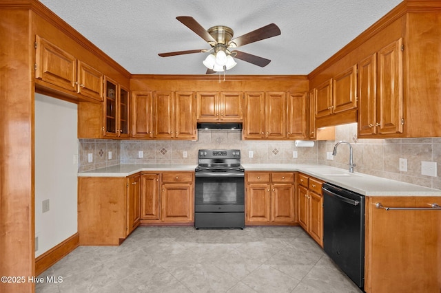 kitchen with black dishwasher, electric stove, brown cabinetry, a sink, and under cabinet range hood