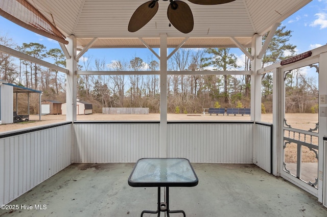 exterior space featuring a patio area and a ceiling fan