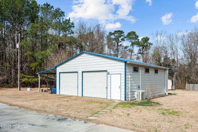 garage featuring a garage and ac unit