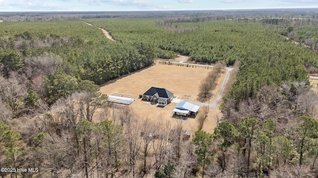 drone / aerial view featuring a forest view and a rural view