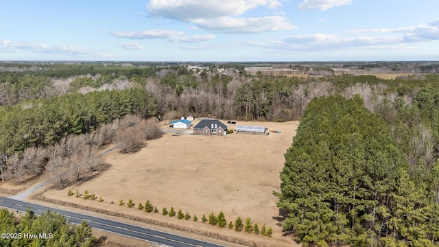 aerial view with a rural view and a wooded view