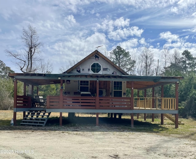 view of front of property featuring a wooden deck