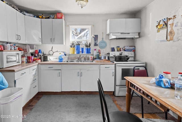 kitchen featuring under cabinet range hood, white appliances, a sink, white cabinetry, and light countertops