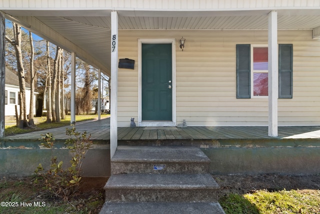 doorway to property featuring a porch