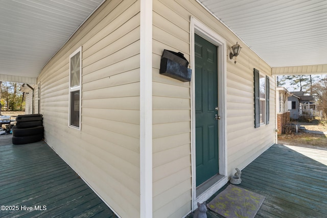 doorway to property featuring covered porch