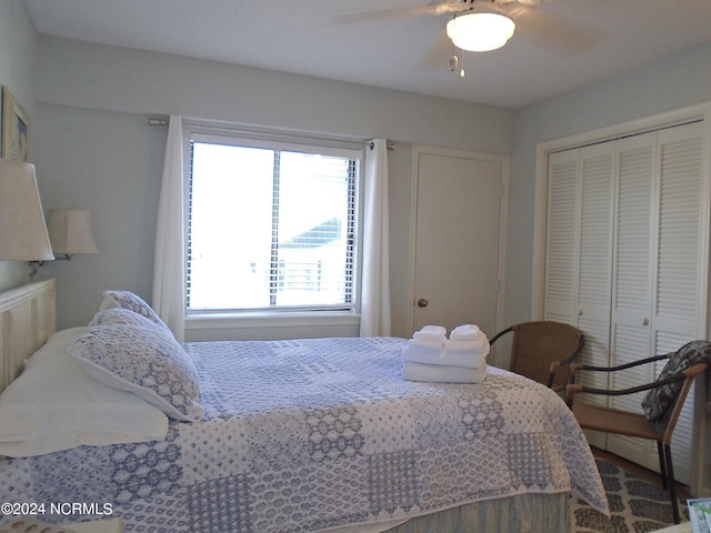 bedroom with a ceiling fan and a closet