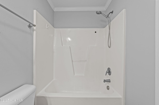 bathroom with shower / washtub combination, crown molding, and toilet