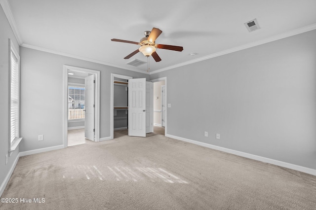 unfurnished bedroom with carpet flooring, visible vents, and baseboards