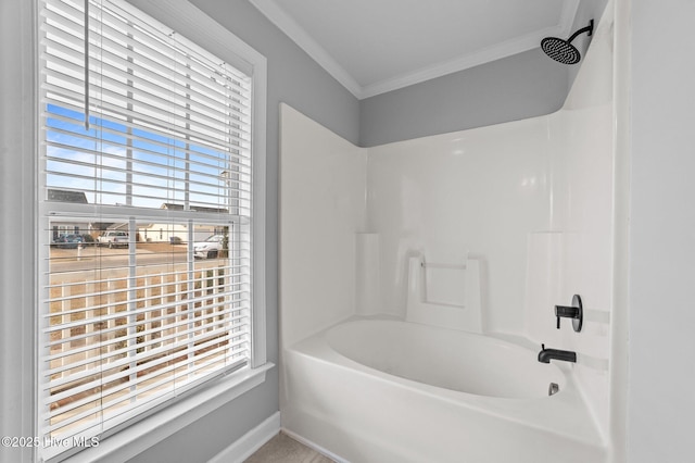 full bathroom with ornamental molding, bathing tub / shower combination, and baseboards