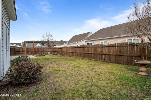 view of yard with a fenced backyard