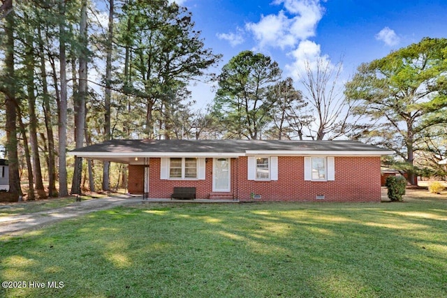 ranch-style house featuring driveway, a carport, a front lawn, crawl space, and brick siding