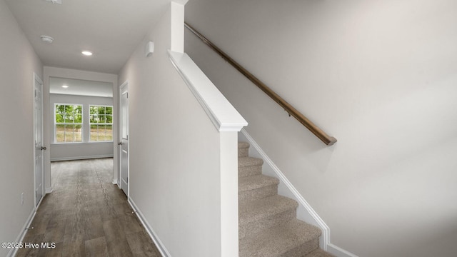 stairway with recessed lighting, baseboards, and wood finished floors