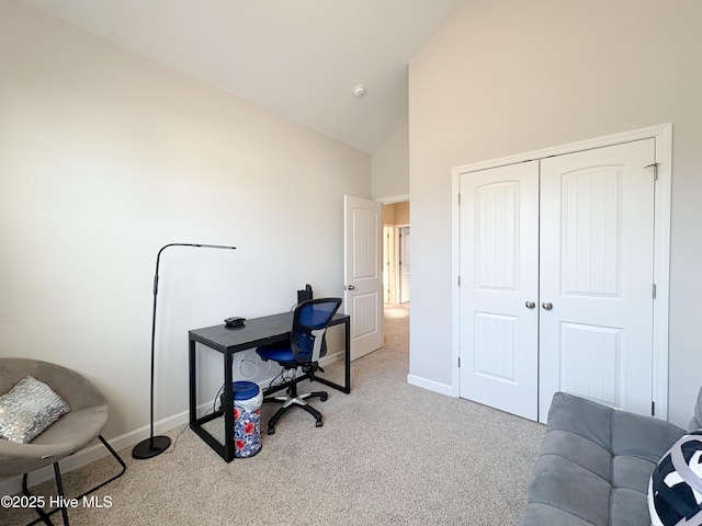 office featuring carpet flooring, high vaulted ceiling, and baseboards