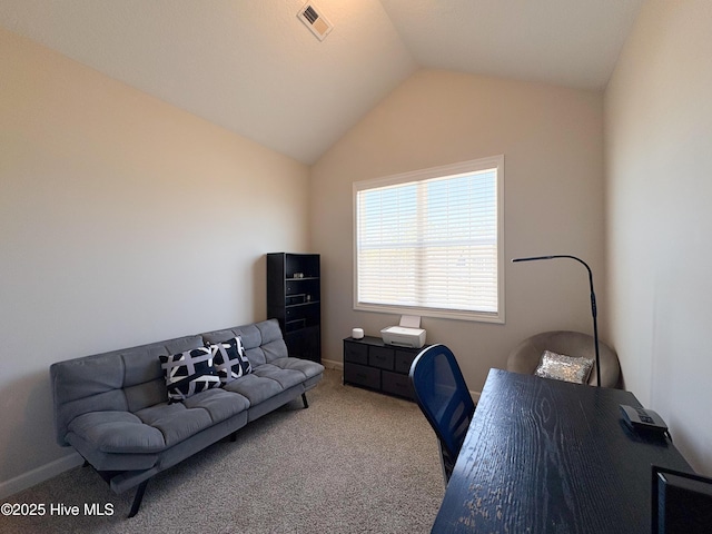 office featuring vaulted ceiling, visible vents, baseboards, and carpet floors